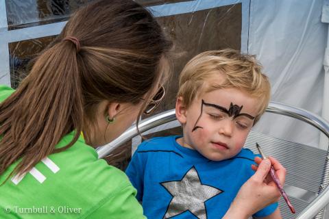 Child having his face painted