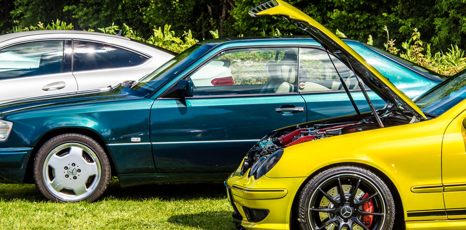 Yellow Mercedes with the bonnet open